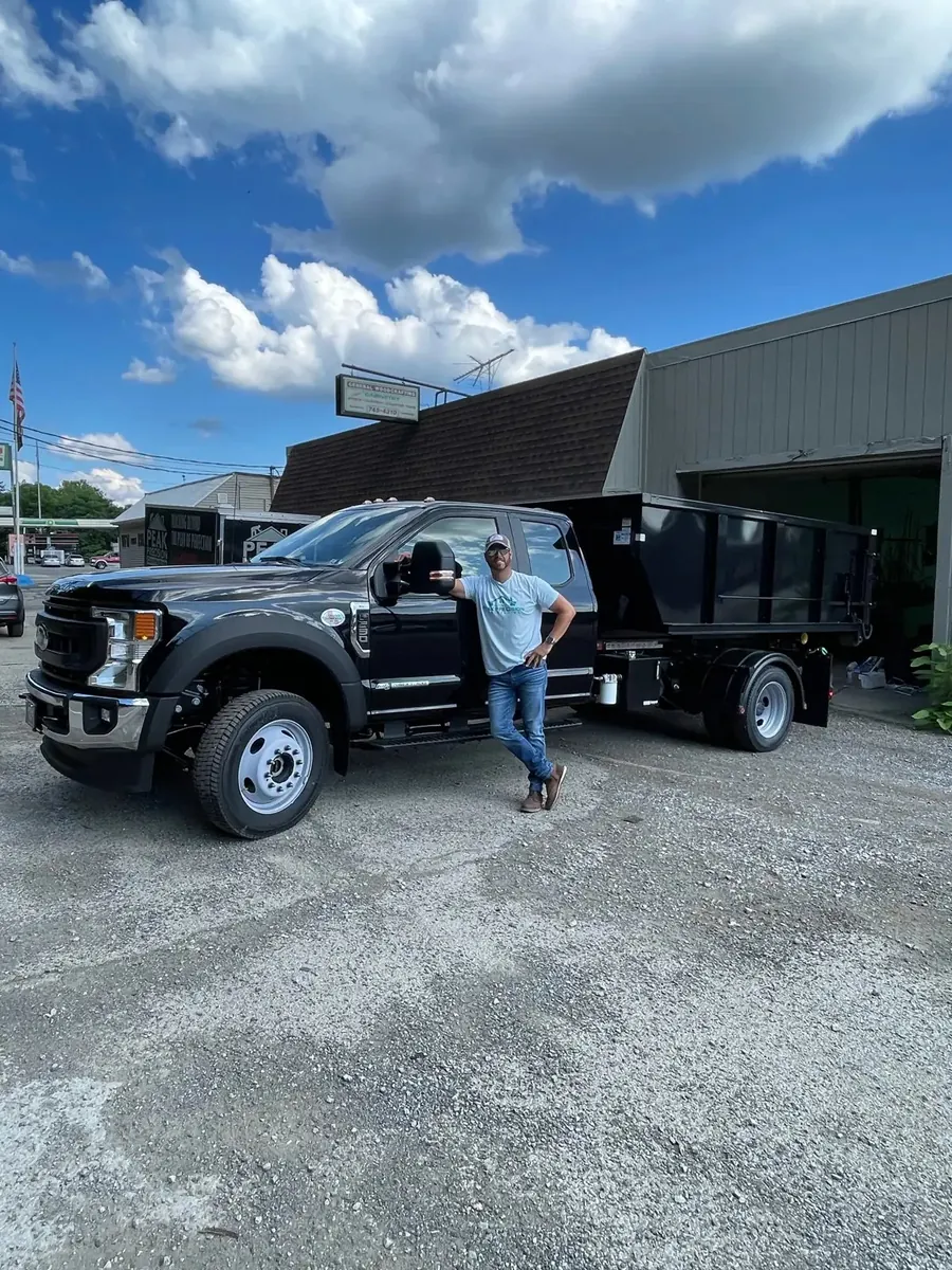 Owner Devin Orsi with the Iron Bear dumpster truck in Canonsburg, PA