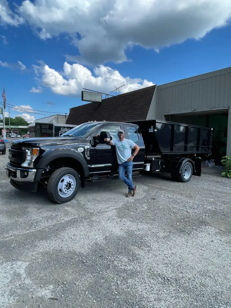 Devin Orsi, owner of Iron Bear & Co., with his dumpster truck in Canonsburg PA