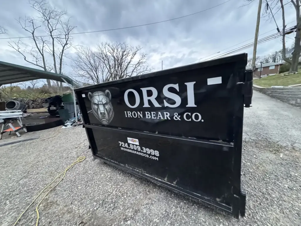 Front of an Iron Bear & Co. roll-off dumpster with the Iron Bear logo and phone number (724) 809-3998