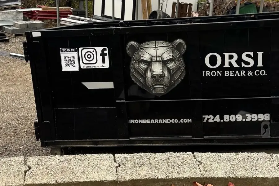 Iron Bear roll-off dumpster placed on a residential driveway
