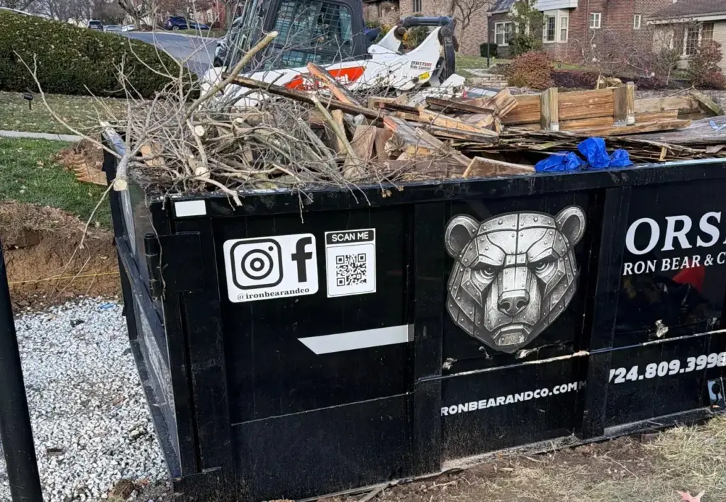 Iron Bear & Co. roll-off dumpster loaded with branches and yard debris in Canonsburg, PA